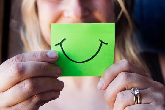 a smiley on a green paper
